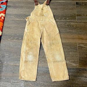 Size 10 hunting/work overalls. Stains and worn areas exist. Still great item!